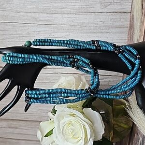 TURQUOISE WOODEN BEAD FOUR STRAND TWISTED NECKLACE